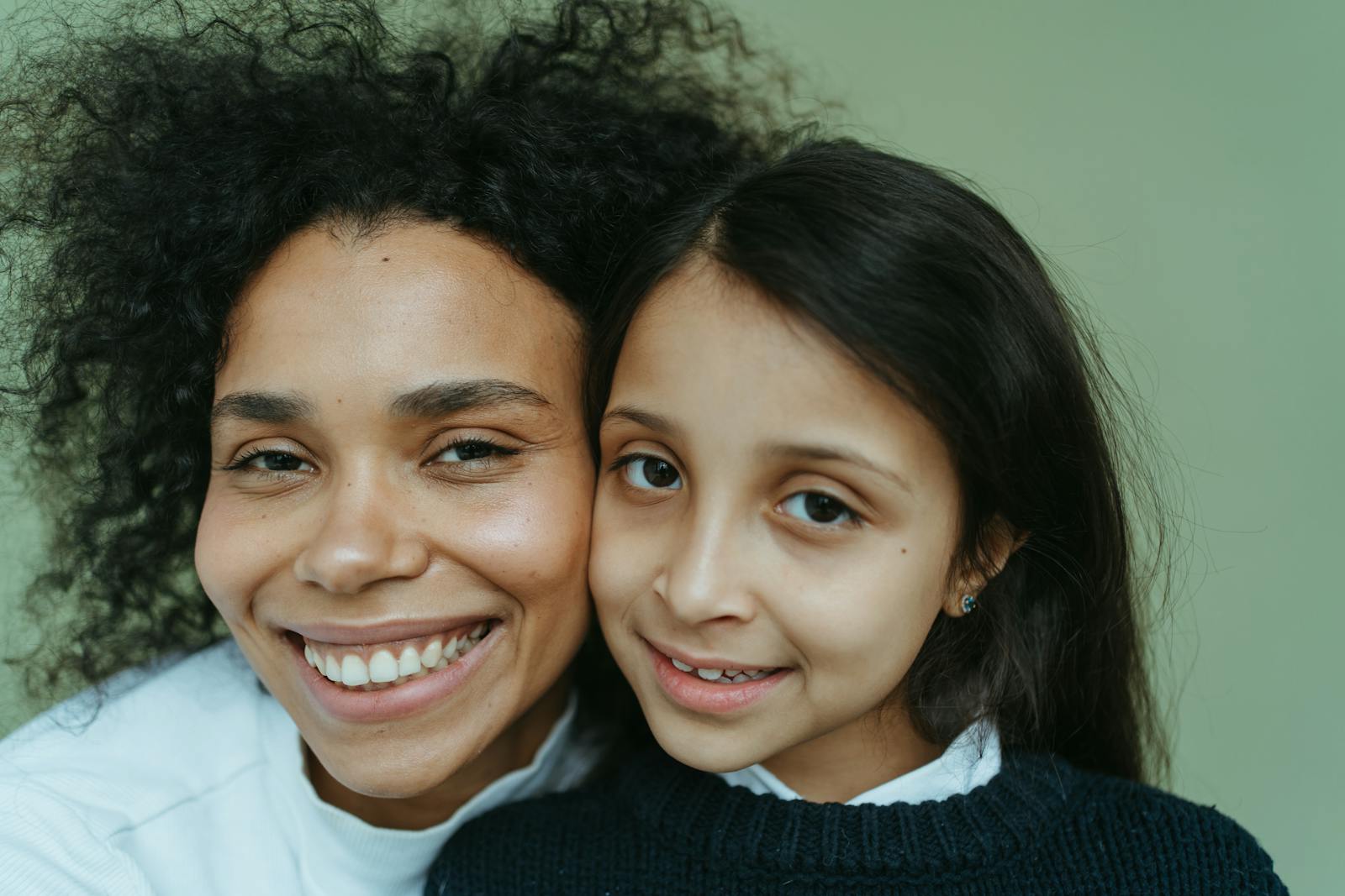 A mother and daughter sharing a moment of warmth